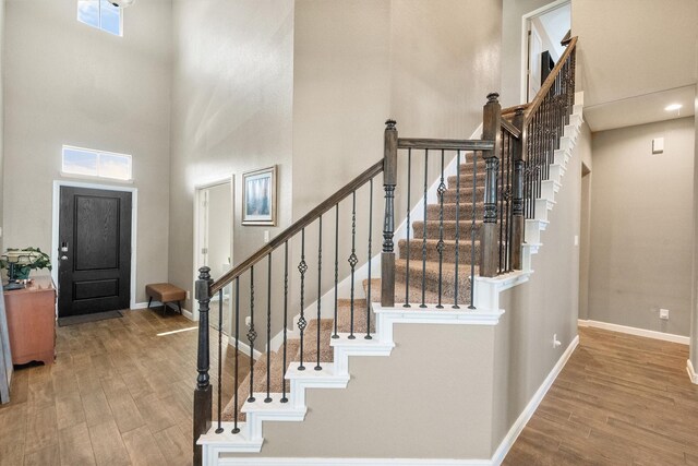 7809 Bella Way, Arlington, TX 76001 - foyer entrance with a high ceiling, wood finished floors, baseboards, and stairs