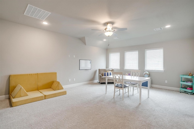carpeted dining area with a ceiling fan, baseboards, visible vents, and recessed lighting