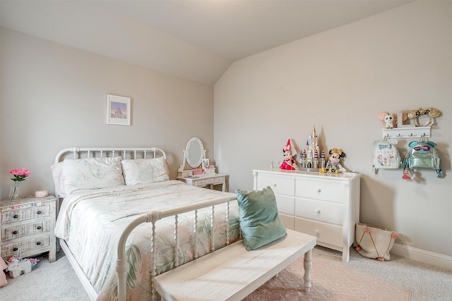 bedroom with baseboards, lofted ceiling, and light colored carpet