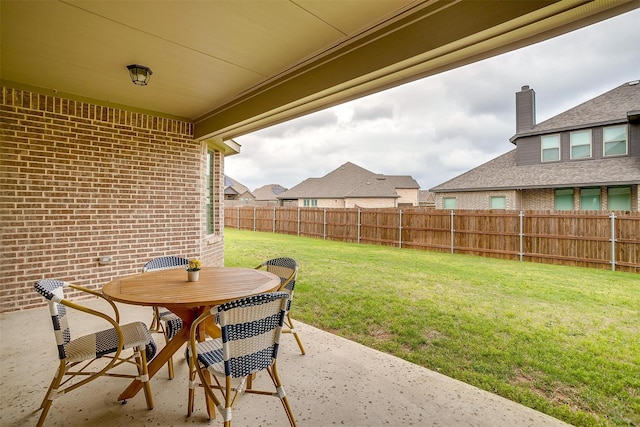 view of patio featuring a fenced backyard and outdoor dining space