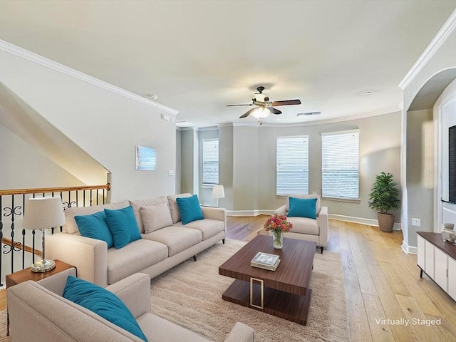 2500 Rockbrook Dr Unit 81, Lewisville, TX 75067 - living room featuring crown molding, visible vents, baseboards, ceiling fan, and light wood finished floors