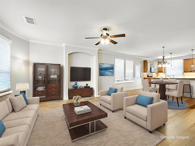 2500 Rockbrook Dr Unit 81, Lewisville, TX 75067 - living area featuring visible vents, light wood-style flooring, crown molding, and ceiling fan