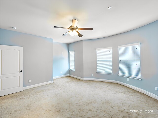 2500 Rockbrook Dr Unit 81, Lewisville, TX 75067 - carpeted spare room with baseboards and ceiling fan