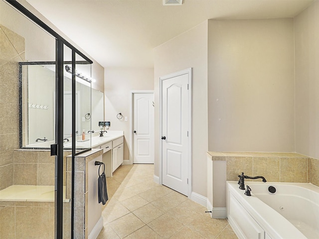 2500 Rockbrook Dr Unit 81, Lewisville, TX 75067 - bathroom with vanity, a shower stall, tile patterned flooring, and a jetted tub