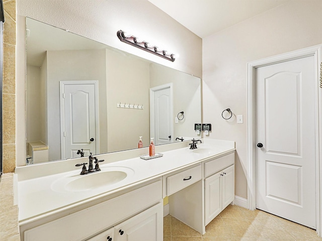 2500 Rockbrook Dr Unit 81, Lewisville, TX 75067 - bathroom featuring a sink, tile patterned floors, and double vanity