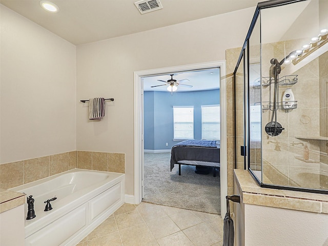 2500 Rockbrook Dr Unit 81, Lewisville, TX 75067 - bathroom with a ceiling fan, visible vents, tile patterned flooring, a tile shower, and ensuite bath