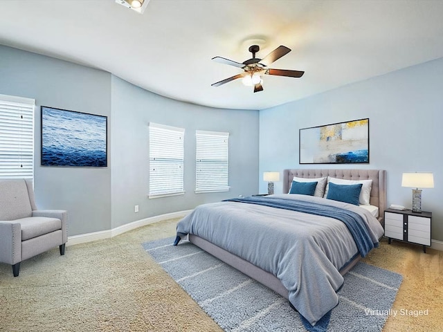 2500 Rockbrook Dr Unit 81, Lewisville, TX 75067 - bedroom with baseboards, carpet, and ceiling fan