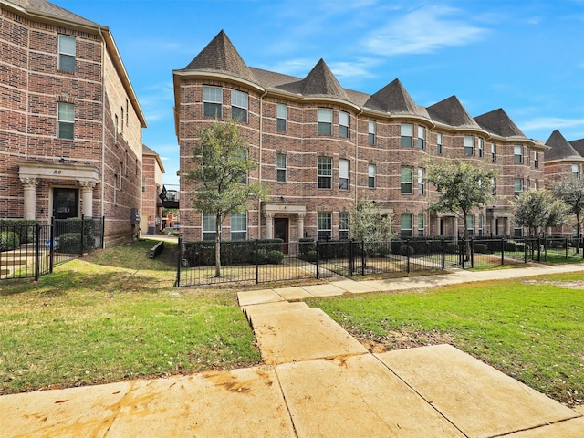 2500 Rockbrook Dr Unit 81, Lewisville, TX 75067 - view of property featuring fence and a residential view