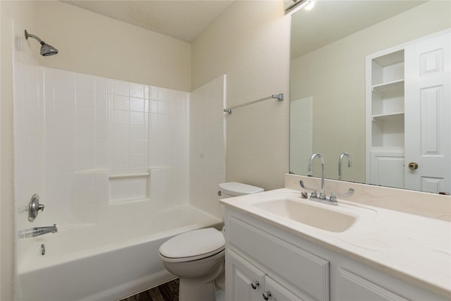 401 Mara Ln, Red Oak, TX 75154 - full bath with vanity, tub / shower combination, wood finished floors, toilet, and a textured ceiling