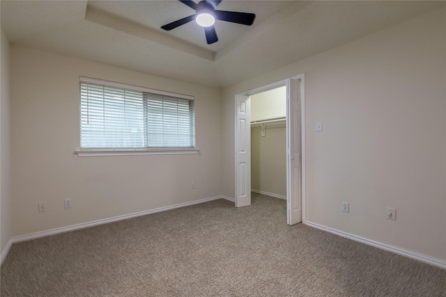 401 Mara Ln, Red Oak, TX 75154 - unfurnished bedroom featuring a raised ceiling, baseboards, ceiling fan, and carpet