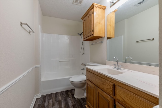 401 Mara Ln, Red Oak, TX 75154 - bathroom featuring visible vents, a textured ceiling, wood finished floors, and toilet