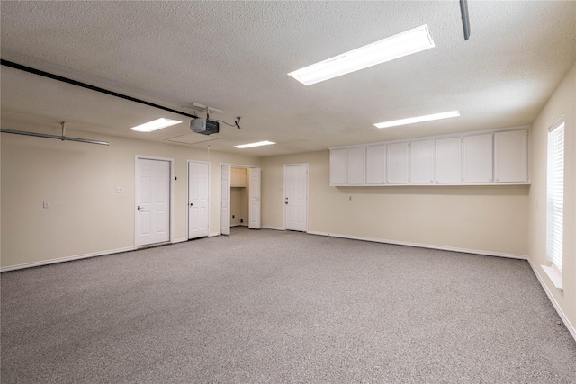 401 Mara Ln, Red Oak, TX 75154 - garage with baseboards and a garage door opener