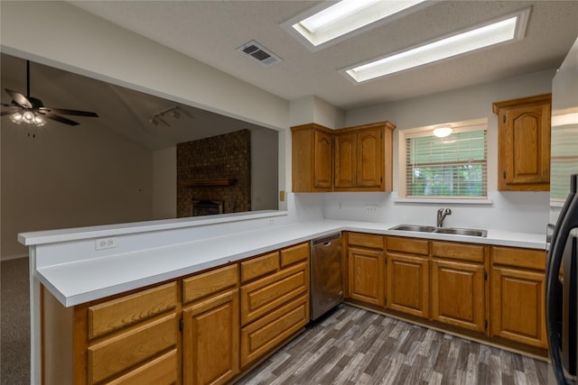 401 Mara Ln, Red Oak, TX 75154 - kitchen featuring a sink, stainless steel dishwasher, brown cabinets, and visible vents