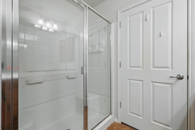 full bath featuring a shower stall