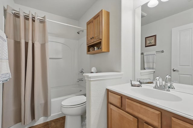 full bath featuring vanity, tile patterned floors, toilet, and shower / tub combo