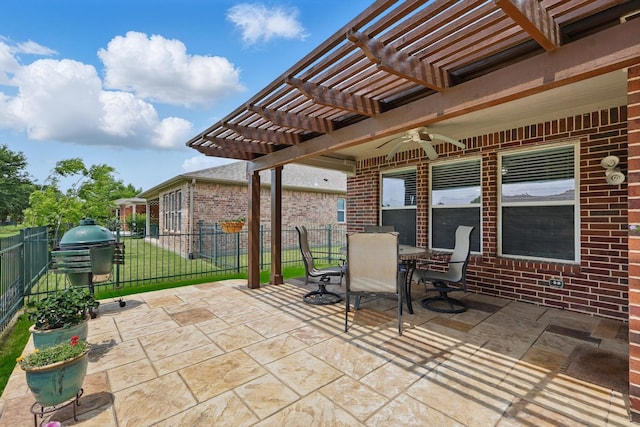 view of patio with area for grilling, a ceiling fan, a fenced backyard, a pergola, and outdoor dining space