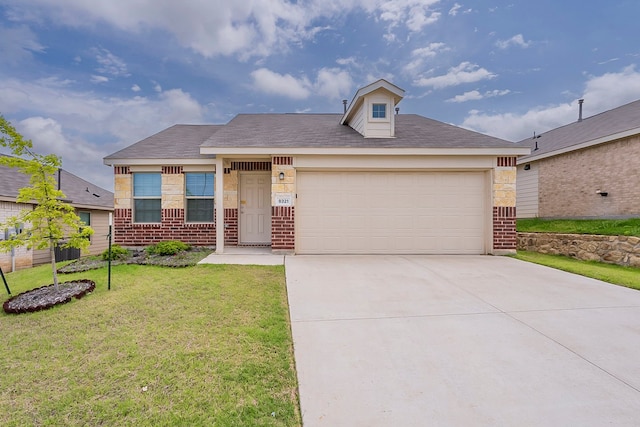 view of front of property with concrete driveway, brick siding, a front lawn, and a garage