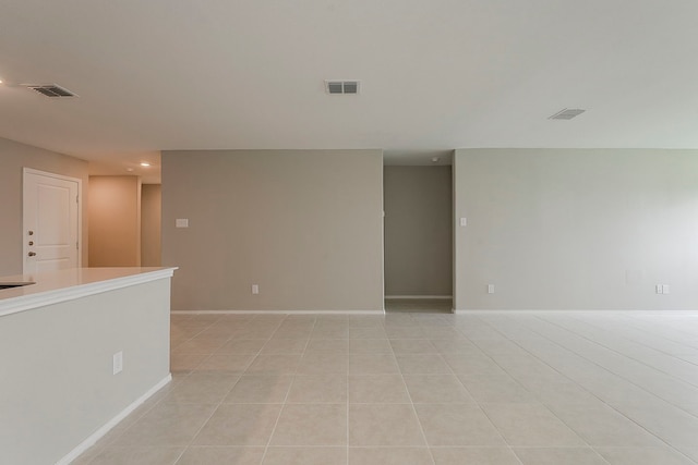 spare room with visible vents, recessed lighting, baseboards, and light tile patterned flooring