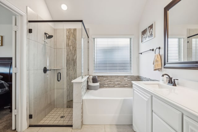 full bath with a garden tub, tile patterned flooring, vanity, lofted ceiling, and a shower stall