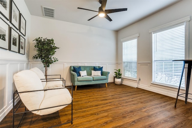 9816 Hedge Bell Dr, Mckinney, TX 75072 - sitting room with wainscoting, a ceiling fan, wood finished floors, and visible vents