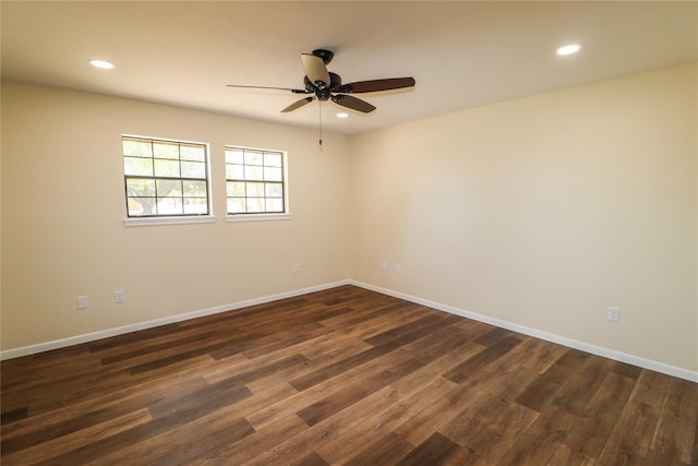 spare room featuring recessed lighting, baseboards, a ceiling fan, and dark wood-style floors