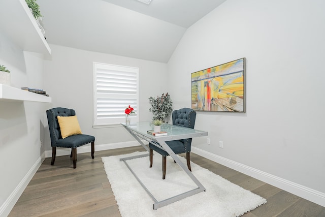 home office with baseboards, vaulted ceiling, and wood finished floors