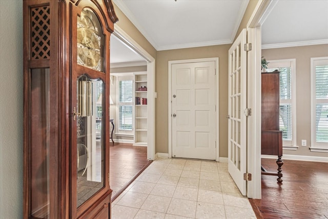 7412 Alto Caro Dr, Dallas, TX 75248 - foyer entrance with french doors, ornamental molding, baseboards, and light tile patterned flooring