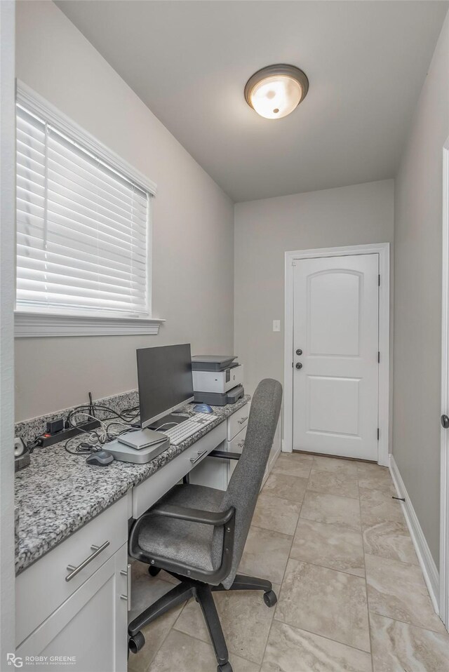 office space featuring baseboards