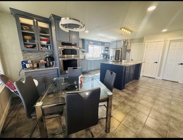 dining area featuring recessed lighting