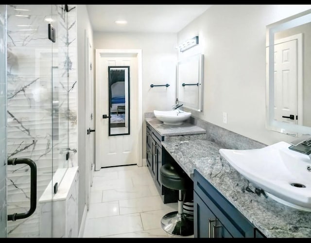full bath featuring recessed lighting, marble finish floor, a marble finish shower, and vanity