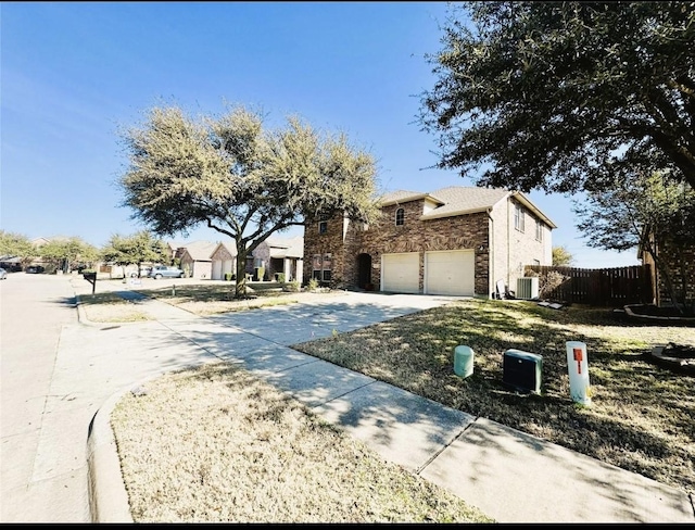 view of front facade featuring driveway, a garage, central air condition unit, fence, and stone siding