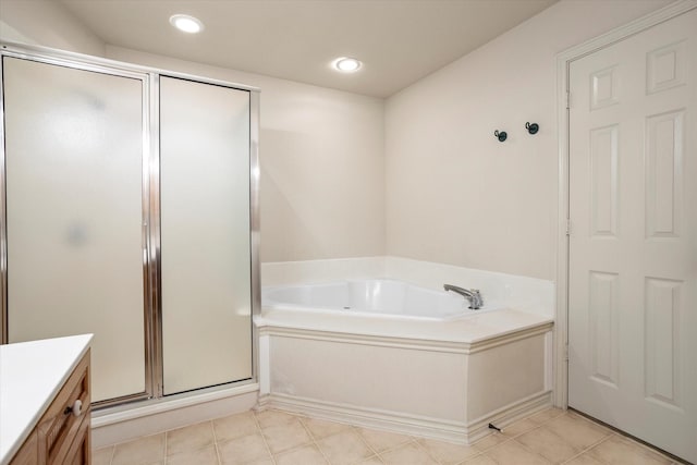bathroom featuring tile patterned flooring, vanity, recessed lighting, a garden tub, and a stall shower