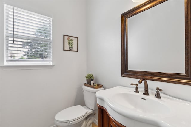 1406 Springmeadow Dr, Allen, TX 75002 - bathroom with toilet, vanity, and baseboards