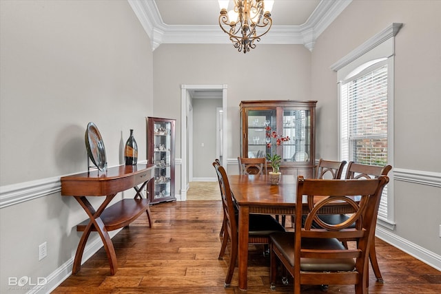 221 Cattail Trl, Benton, LA 71006 - dining space with crown molding, wood finished floors, and a chandelier