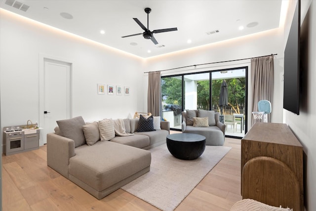 living area featuring recessed lighting, ceiling fan, visible vents, and light wood-type flooring