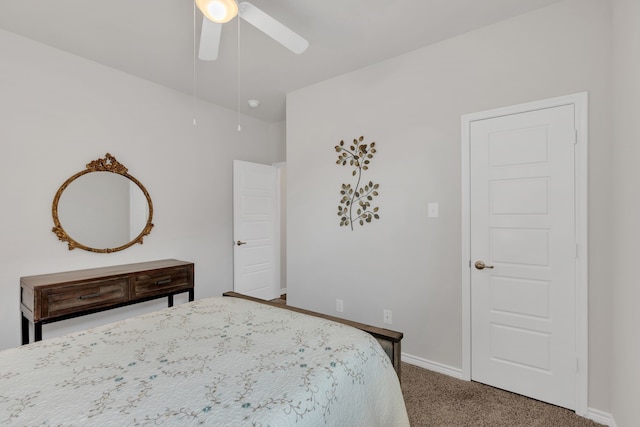 carpeted bedroom with baseboards and ceiling fan