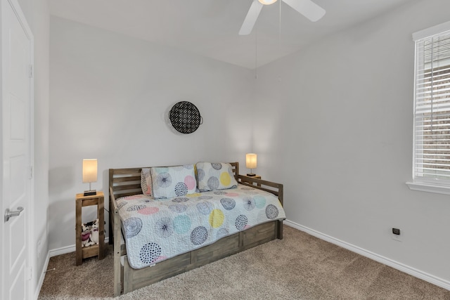 bedroom with baseboards, ceiling fan, and carpet flooring