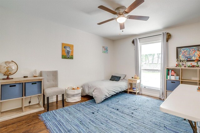 bedroom featuring a ceiling fan and wood finished floors
