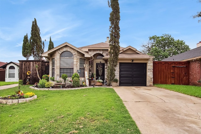 2704 Game Lake Dr, Irving, TX 75060 - view of front facade with a garage, a front lawn, fence, and driveway