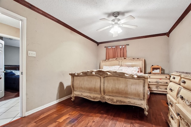 2704 Game Lake Dr, Irving, TX 75060 - bedroom with crown molding, a textured ceiling, ceiling fan, and hardwood / wood-style floors