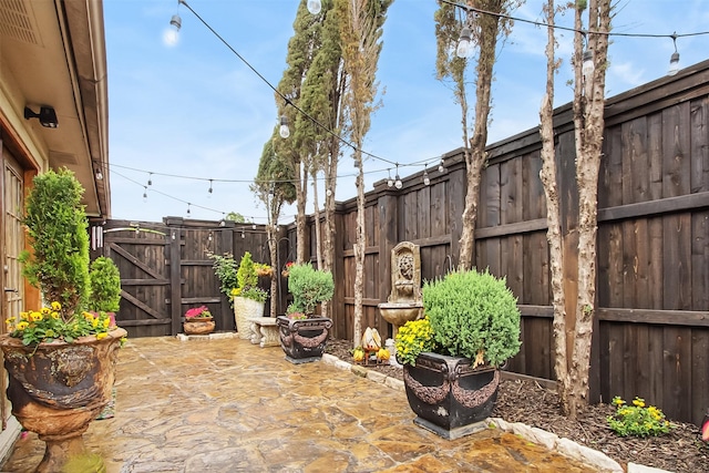 2704 Game Lake Dr, Irving, TX 75060 - view of patio with a fenced backyard and a gate