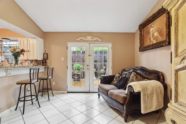 2704 Game Lake Dr, Irving, TX 75060 - interior space with french doors, baseboards, light tile patterned floors, and lofted ceiling