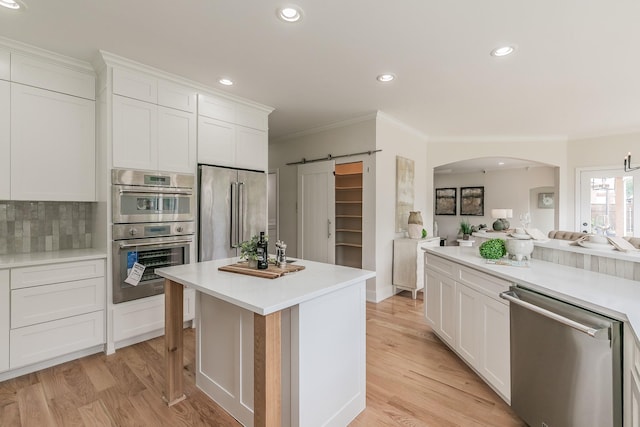 300 Preakness Cir, Southlake, TX 76092 - kitchen with stainless steel appliances, crown molding, white cabinetry, light countertops, and recessed lighting