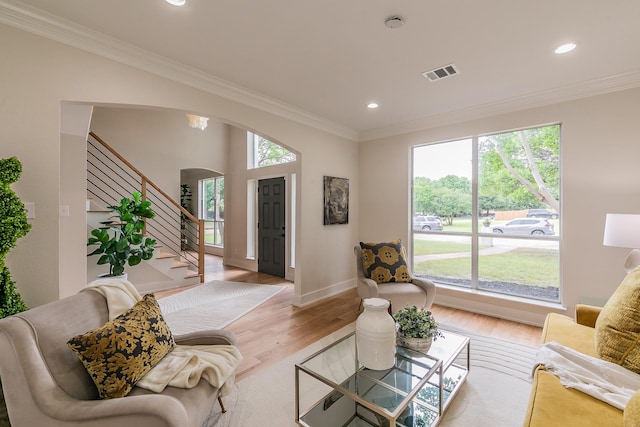 300 Preakness Cir, Southlake, TX 76092 - living room with arched walkways, plenty of natural light, crown molding, wood finished floors, and recessed lighting