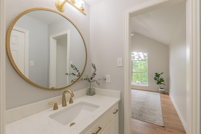 300 Preakness Cir, Southlake, TX 76092 - bathroom with wood finished floors, vanity, lofted ceiling, and baseboards