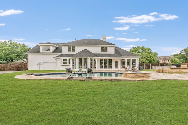 300 Preakness Cir, Southlake, TX 76092 - rear view of property with a patio area, a chimney, a shingled roof, a pool with connected hot tub, and a sunroom