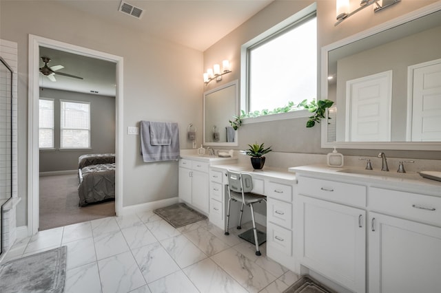 bathroom with double vanity, ceiling fan, visible vents, a sink, and marble finish floor
