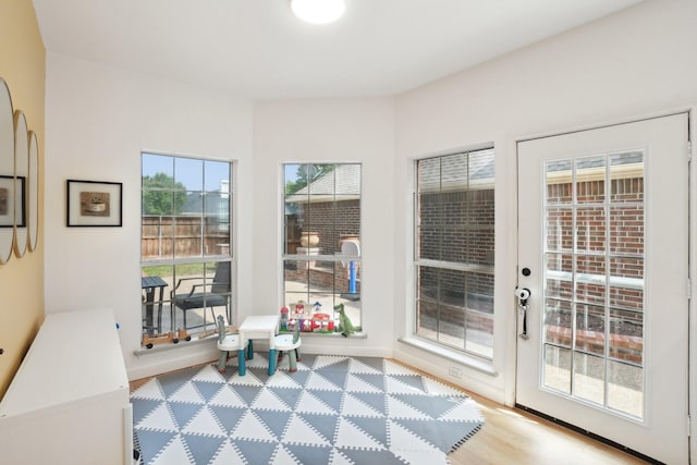 doorway to outside with baseboards