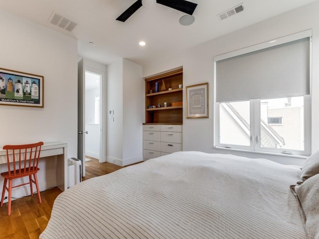bedroom featuring recessed lighting, ceiling fan, visible vents, and light wood-style floors