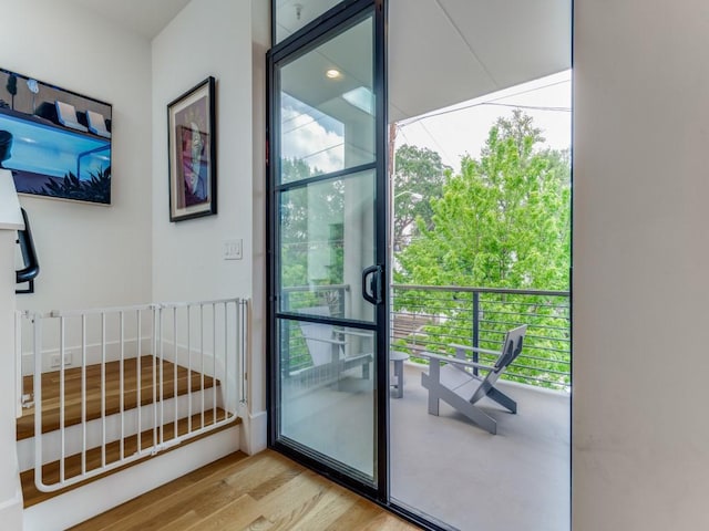 doorway featuring wood finished floors